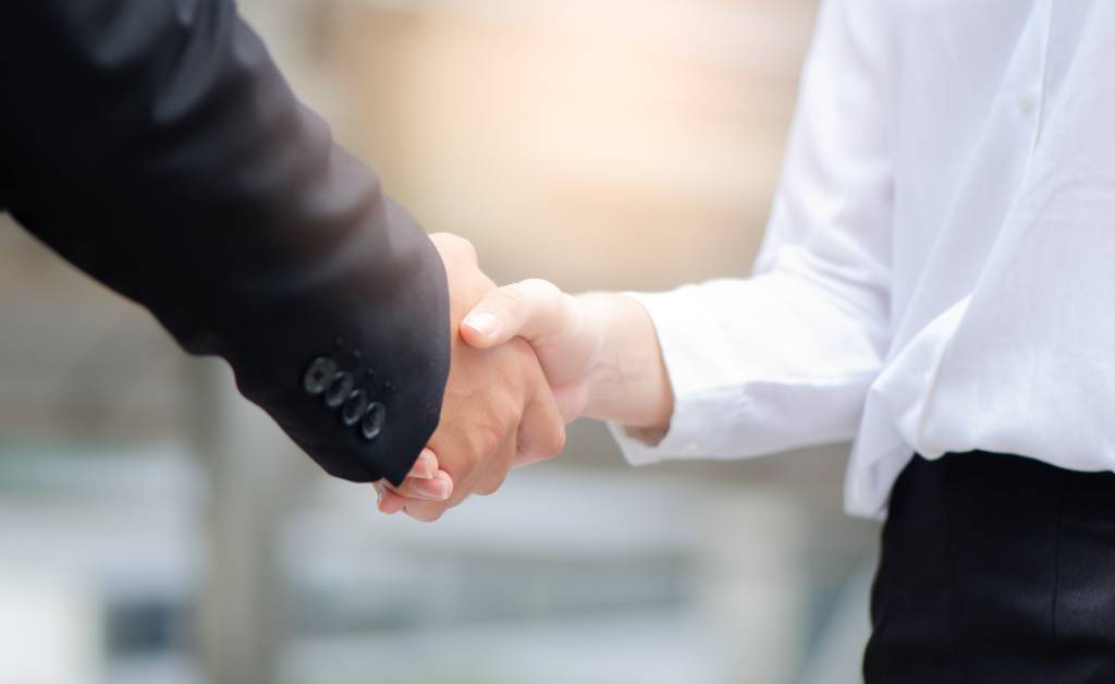 Business handshake agreement partnership after the meeting