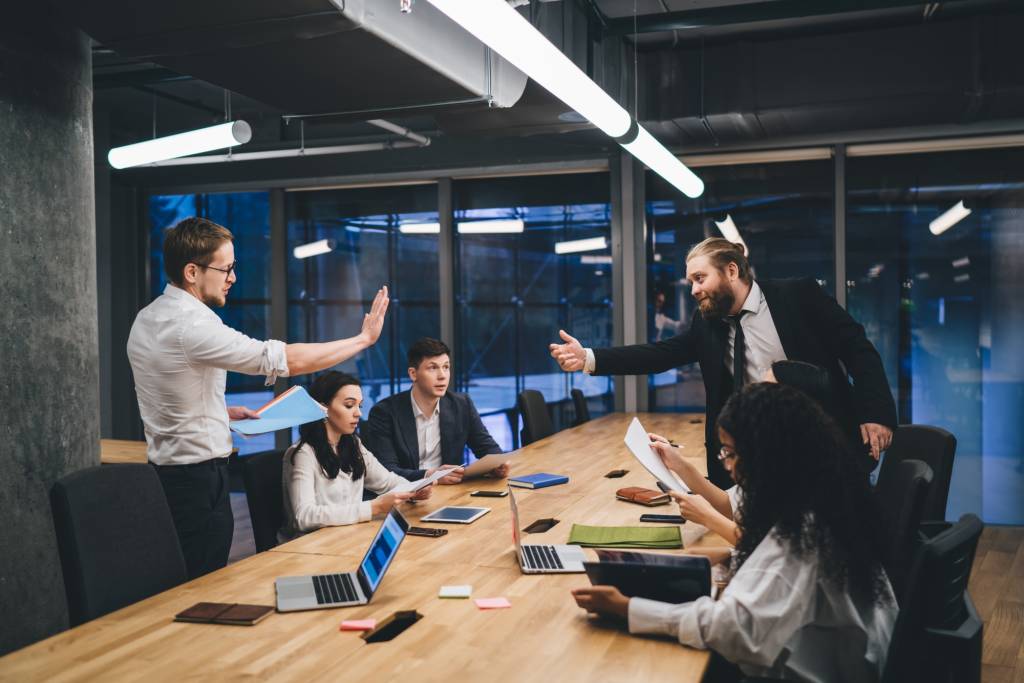 Businesspeople during negotiations in modern workplace