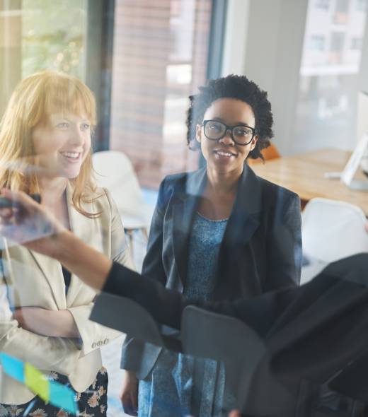 Business discussions. Shot of businesswomen brainstorming in an office. Business discussions. Shot of businesswomen brainstorming in an office.