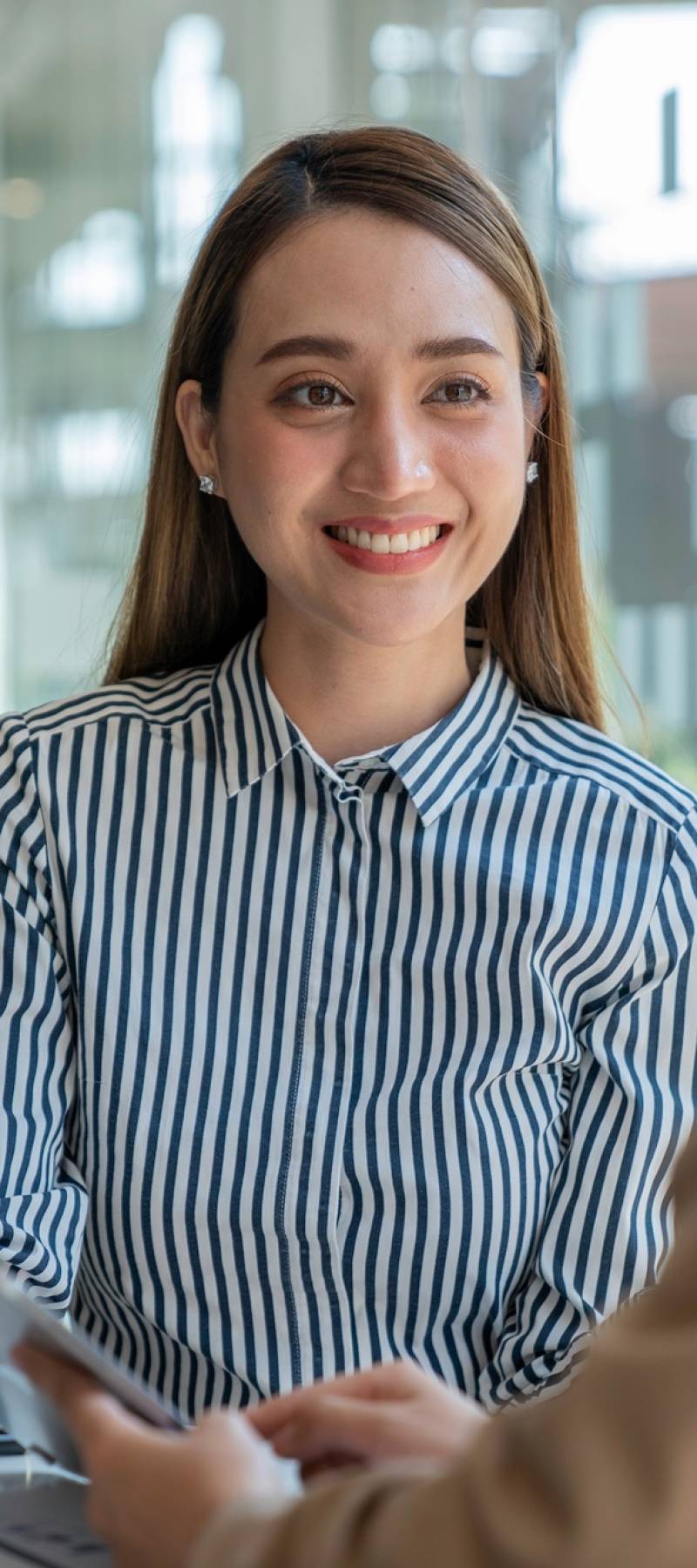 Negotiation, Analysis, Discussion, Asian woman economist and marketer pointing to a financial data s Negotiation, Analysis, Discussion, Asian woman economist and marketer pointing to a financial data s